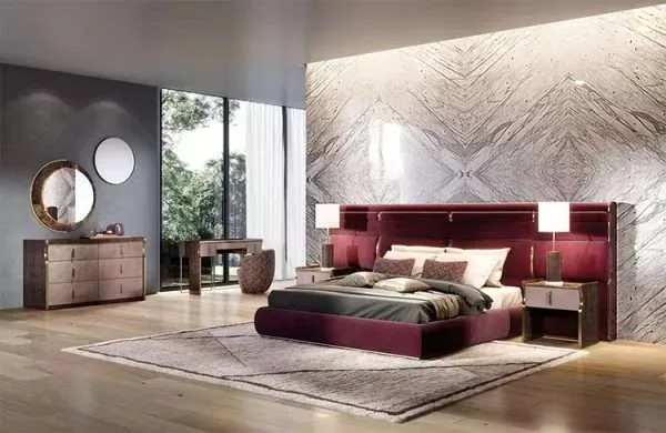 Luxurious Master Bedroom with Burgundy Upholstered Bed and Gold Accents